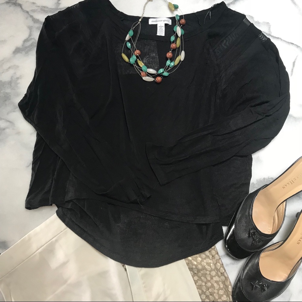 Black cropped high low knit top with mesh cutouts